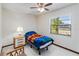 Bedroom with ceiling fan, carpet floors, a window, and a nightstand at 2007 Peach Tree Blvd, St Cloud, FL 34769