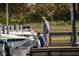 People fishing on the dock with boats, creating a relaxing waterfront scene at 2007 Peach Tree Blvd, St Cloud, FL 34769