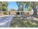 Inviting single-Gathering house with a spacious driveway and well-maintained landscaping at 2007 Peach Tree Blvd, St Cloud, FL 34769