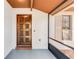 Welcoming front porch featuring a beautifully carved wooden door and textured walls at 2007 Peach Tree Blvd, St Cloud, FL 34769