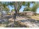 Charming home exterior with mature trees providing shade over the yard at 2007 Peach Tree Blvd, St Cloud, FL 34769