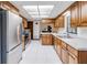 Spacious kitchen featuring stainless steel appliances, ample counter space and tile floor at 2007 Peach Tree Blvd, St Cloud, FL 34769