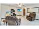 Comfortable living room with neutral color scheme, tile flooring, and entertainment center at 2007 Peach Tree Blvd, St Cloud, FL 34769