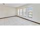 Bright living room showcasing neutral walls, tile floors and many windows at 2007 Peach Tree Blvd, St Cloud, FL 34769
