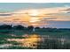Beautiful sunset view, creating a serene atmosphere near the water with a distant sailboat at 2007 Peach Tree Blvd, St Cloud, FL 34769
