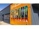 Colorful welcome mural of St. Cloud, Florida, featuring various scenes and landmarks at 2007 Peach Tree Blvd, St Cloud, FL 34769