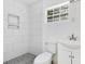 Clean bathroom featuring a modern tiled shower, updated toilet, and a modern sink at 2108 Silver Leaf Ct, Longwood, FL 32779