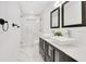 Modern bathroom featuring a double vanity, glass shower, and marble floors at 2108 Silver Leaf Ct, Longwood, FL 32779