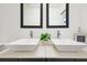 Modern bathroom featuring double sinks with square basins, sleek faucets, and decorative accents at 2108 Silver Leaf Ct, Longwood, FL 32779
