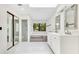 Modern bathroom with double vanity, a soaking tub, glass shower and large windows at 2108 Silver Leaf Ct, Longwood, FL 32779
