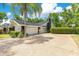 Charming home with a two-car garage, elegant landscaping, and a spacious driveway at 2108 Silver Leaf Ct, Longwood, FL 32779