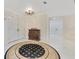 Inviting foyer with marble floors, arched doorway, modern lighting and decorative cabinet at 2108 Silver Leaf Ct, Longwood, FL 32779