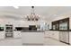 Modern kitchen with white cabinetry, stainless steel appliances, and a spacious island at 2108 Silver Leaf Ct, Longwood, FL 32779