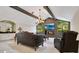 Elegant living room featuring a fireplace, large windows, and a decorative chandelier at 2108 Silver Leaf Ct, Longwood, FL 32779