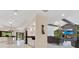 Open-concept layout connecting the kitchen and living room with luxurious tile flooring at 2108 Silver Leaf Ct, Longwood, FL 32779