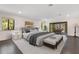 Staged main bedroom featuring a king bed, hardwood floors, natural light and access to the outdoors at 2108 Silver Leaf Ct, Longwood, FL 32779