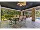 Screened patio featuring outdoor dining and decorative columns, perfect for relaxing and entertaining at 2108 Silver Leaf Ct, Longwood, FL 32779