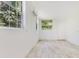 Bright room with windows and tiled floors, offering versatility for an office, gym, or guest room at 2108 Silver Leaf Ct, Longwood, FL 32779