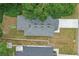 Aerial view of a single-Gathering home with a gray roof and green grass at 2618 Sidney Ave, Orlando, FL 32810