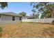 Expansive backyard featuring a white fence and some trees at 2618 Sidney Ave, Orlando, FL 32810