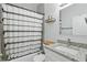This bathroom features a shower and tub combination, granite counters and stylish decor at 2618 Sidney Ave, Orlando, FL 32810