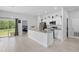 Open kitchen featuring white cabinets, granite countertops, and stainless steel appliances at 2618 Sidney Ave, Orlando, FL 32810