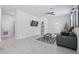 Stylish living room with tile flooring, modern decor, and an open layout to the rest of the home at 2618 Sidney Ave, Orlando, FL 32810