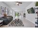 Spacious living room with tile flooring, modern decor, and an open layout with a ceiling fan at 2618 Sidney Ave, Orlando, FL 32810