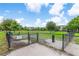 Enclosed dog park with ample green space, play equipment, and beautiful landscaping at 2707 E Marks St, Orlando, FL 32803