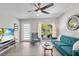 Cozy living room with a ceiling fan, comfortable seating, and a view of the outdoors at 2707 E Marks St, Orlando, FL 32803