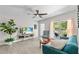 Stylish living room with vaulted ceiling and large window offering plenty of natural light at 2707 E Marks St, Orlando, FL 32803