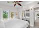 Well lit Main bedroom featuring sliding closet doors, ceiling fan, and glass patio doors at 2707 E Marks St, Orlando, FL 32803