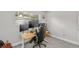 Bright office with multiple monitors, ergonomic chair, light wood desk, and ample natural light at 2707 E Marks St, Orlando, FL 32803