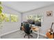 Bright home office space with natural light, a modern desk setup, and wood-look floors at 2707 E Marks St, Orlando, FL 32803