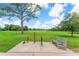 Expansive green park features bike repair station and inviting bench seating under a picturesque blue sky at 2707 E Marks St, Orlando, FL 32803