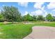 Community park featuring green space, play areas, and walking paths near modern residential buildings at 2707 E Marks St, Orlando, FL 32803