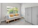 A bright room features a small couch, large gray cabinets, and a window at 2707 E Marks St, Orlando, FL 32803