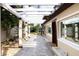 Charming backyard with a pergola-covered patio and a well-maintained walkway at 2711 Parkland Dr, Winter Park, FL 32789
