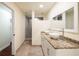 Modern bathroom with double vessel sinks, granite countertops, and a frameless glass shower at 2711 Parkland Dr, Winter Park, FL 32789
