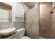 This bathroom features a vessel sink, stone countertop, tiled shower, and white vanity with drawers and cabinets at 2711 Parkland Dr, Winter Park, FL 32789