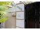 Welcoming entrance featuring a decorative address plaque and a secure wooden gate at 2711 Parkland Dr, Winter Park, FL 32789