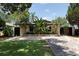 Inviting front yard with lush landscaping and a charming, paved walkway leading to the home at 2711 Parkland Dr, Winter Park, FL 32789