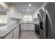 Well-lit kitchen with white cabinets, granite countertops, stainless steel appliances, and subway tile backsplash at 2711 Parkland Dr, Winter Park, FL 32789
