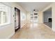 Inviting living area featuring neutral paint, stone floors, and access to the outdoor space at 2711 Parkland Dr, Winter Park, FL 32789