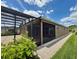 Enclosed lanai and screened in porch offers indoor/outdoor living space with a view of the backyard at 274 Brunswick Dr, Davenport, FL 33837
