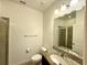 Bathroom featuring tile floors, vanity, mirror, and glass-enclosed shower at 274 Brunswick Dr, Davenport, FL 33837