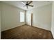 Bedroom featuring carpeted floor, ceiling fan, and natural light at 274 Brunswick Dr, Davenport, FL 33837