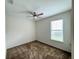 Bedroom with carpet flooring, a ceiling fan, and natural light from the window at 274 Brunswick Dr, Davenport, FL 33837