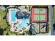 Aerial view of community amenities including a pool, waterpark, and tennis courts at 274 Brunswick Dr, Davenport, FL 33837