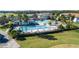 Community pool area with pools, waterslides, pergolas, and lounge chairs at 274 Brunswick Dr, Davenport, FL 33837